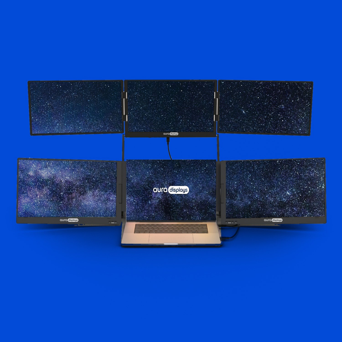 Milky Way wallpaper shown across six Aura Displays screens with a laptop