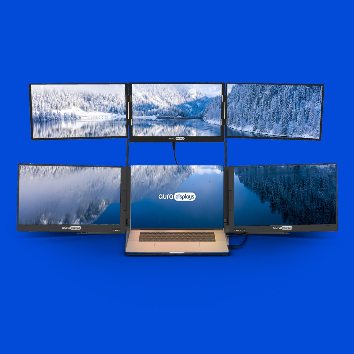 Winter Lake wallpaper shown across six Aura Displays screens with a laptop